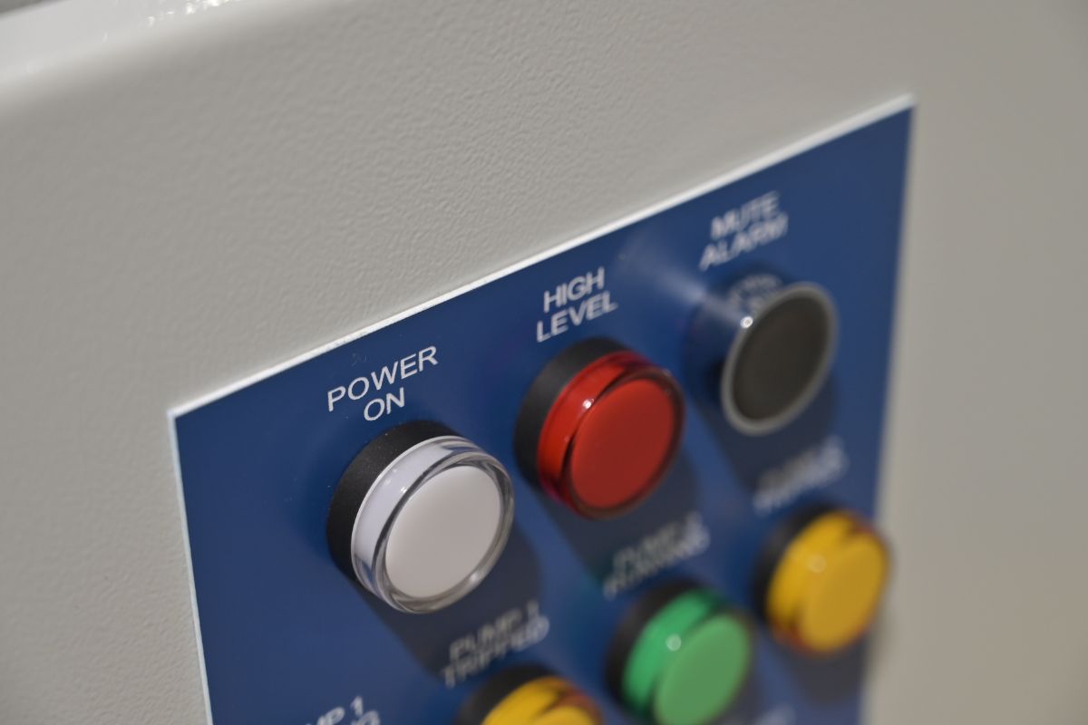 Close-up of the Basix door: power on, high level and mute button