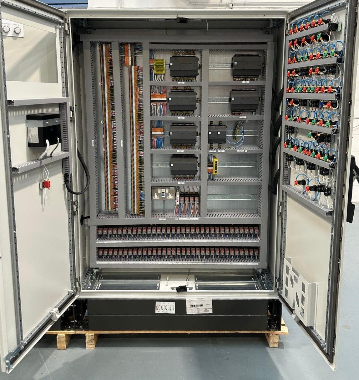 Floor-standing BMS panel with the doors open