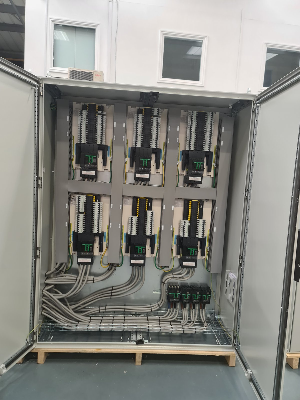 Inside a bay: variable speed drives on the backplate with the motor cables dressed below