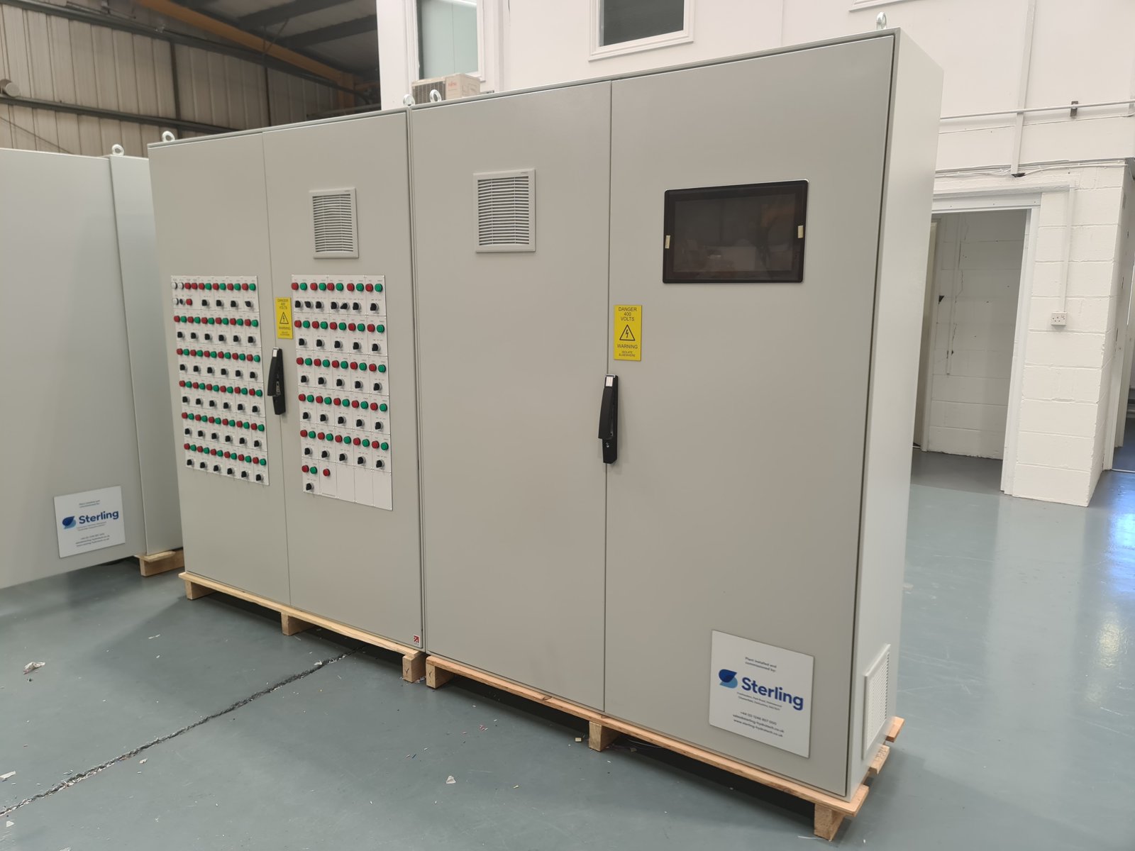 Three-bay floor-standing motor control centre for Butlins Skegness, doors closed, on a pallet in the G&G factory