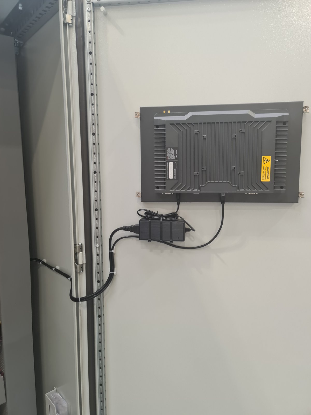 Touchscreen HMI mounted in a panel door
