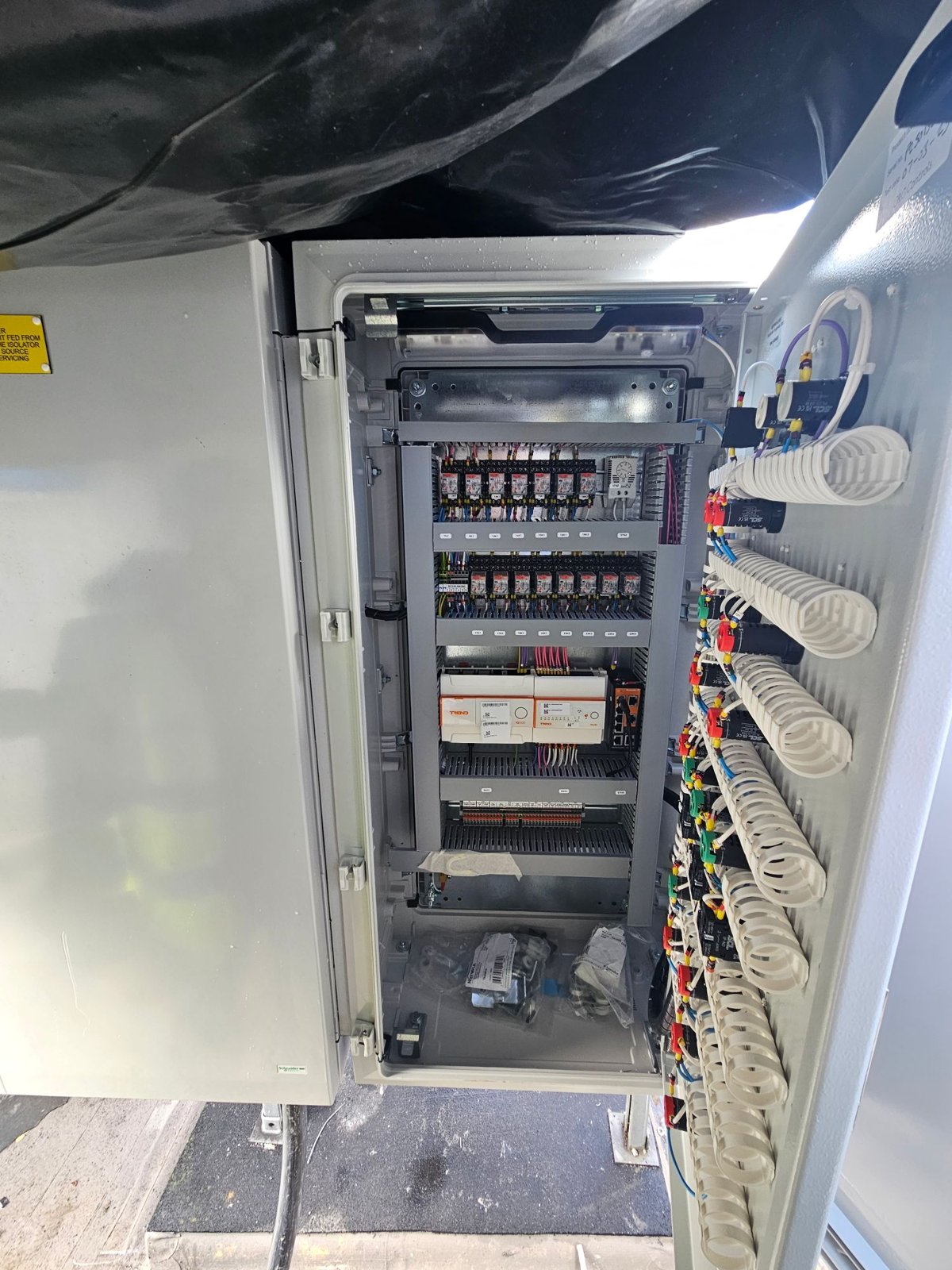 Panel on the roof with the door open, showing the door-mounted relays and the Form 2 segregated interior