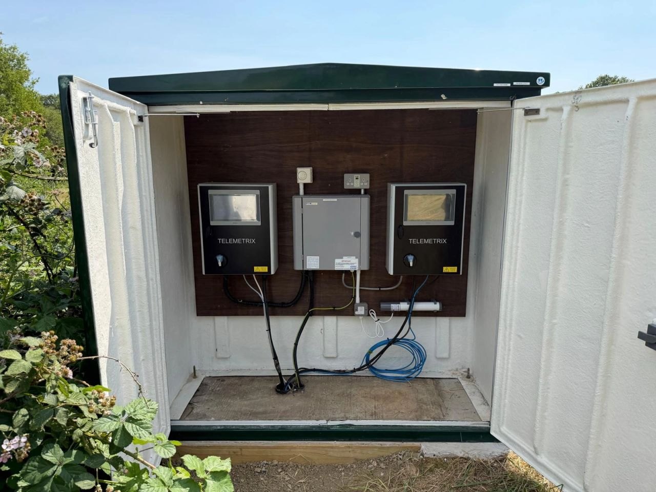 Two Telemetrix control panels installed side by side in a GRP kiosk at a West Sussex County Council landfill site