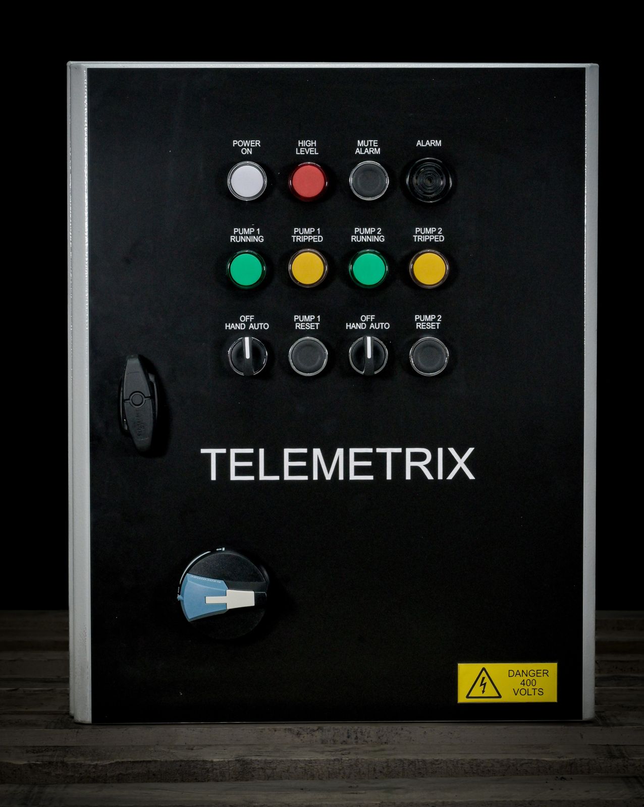 Telemetrix wastewater pump control panel, black enclosure with lamps and switches